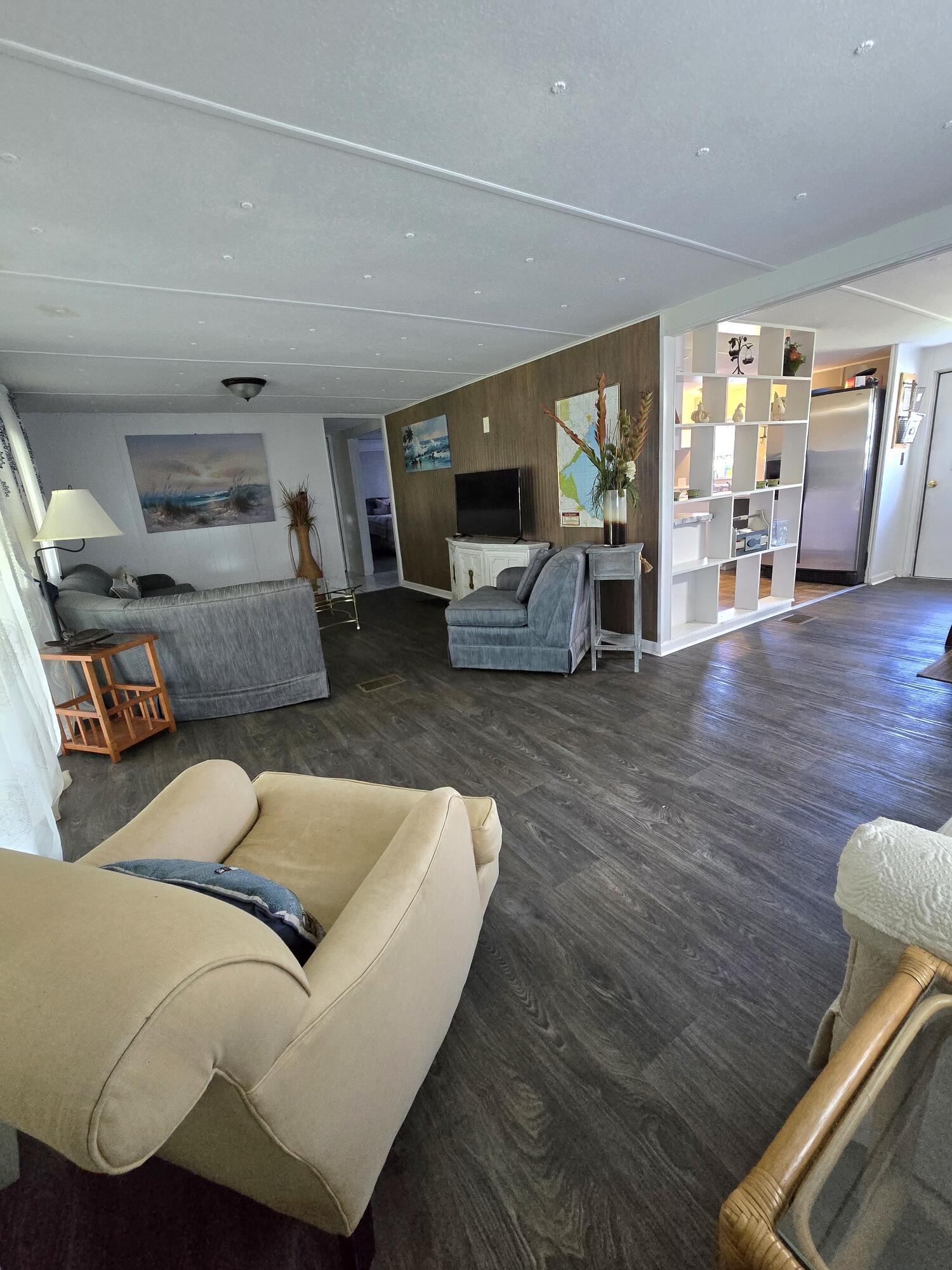 2612 Southeast 29th Street Okeechobee, FL 34974 - Photo 13 of 46 a living room with furniture and a fireplace