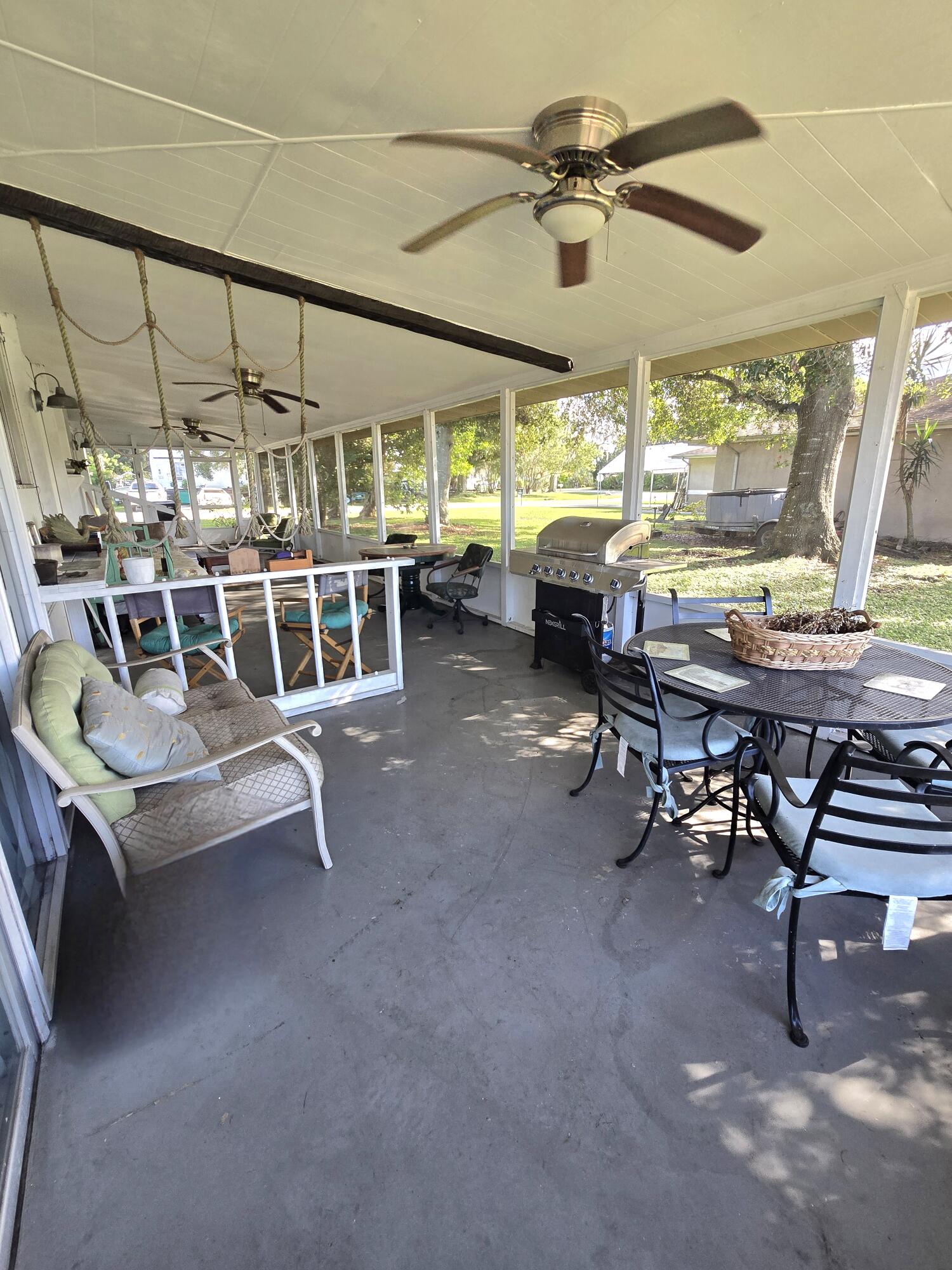 2612 Southeast 29th Street Okeechobee, FL 34974 - Photo 36 of 46 a view of a dining room with furniture window and outside view