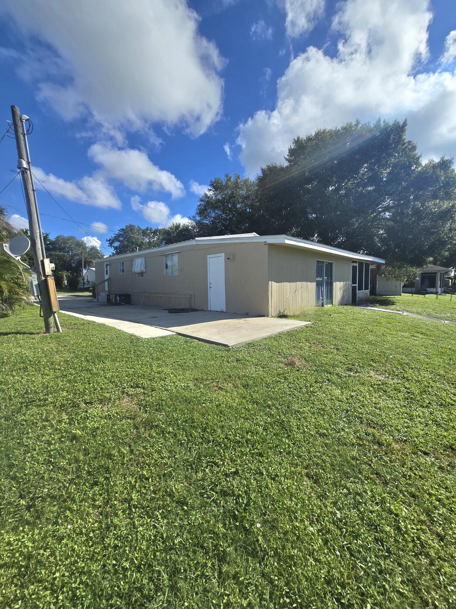 2612 Southeast 29th Street Okeechobee, FL 34974 - Photo 41 of 46 a view of a house with a yard