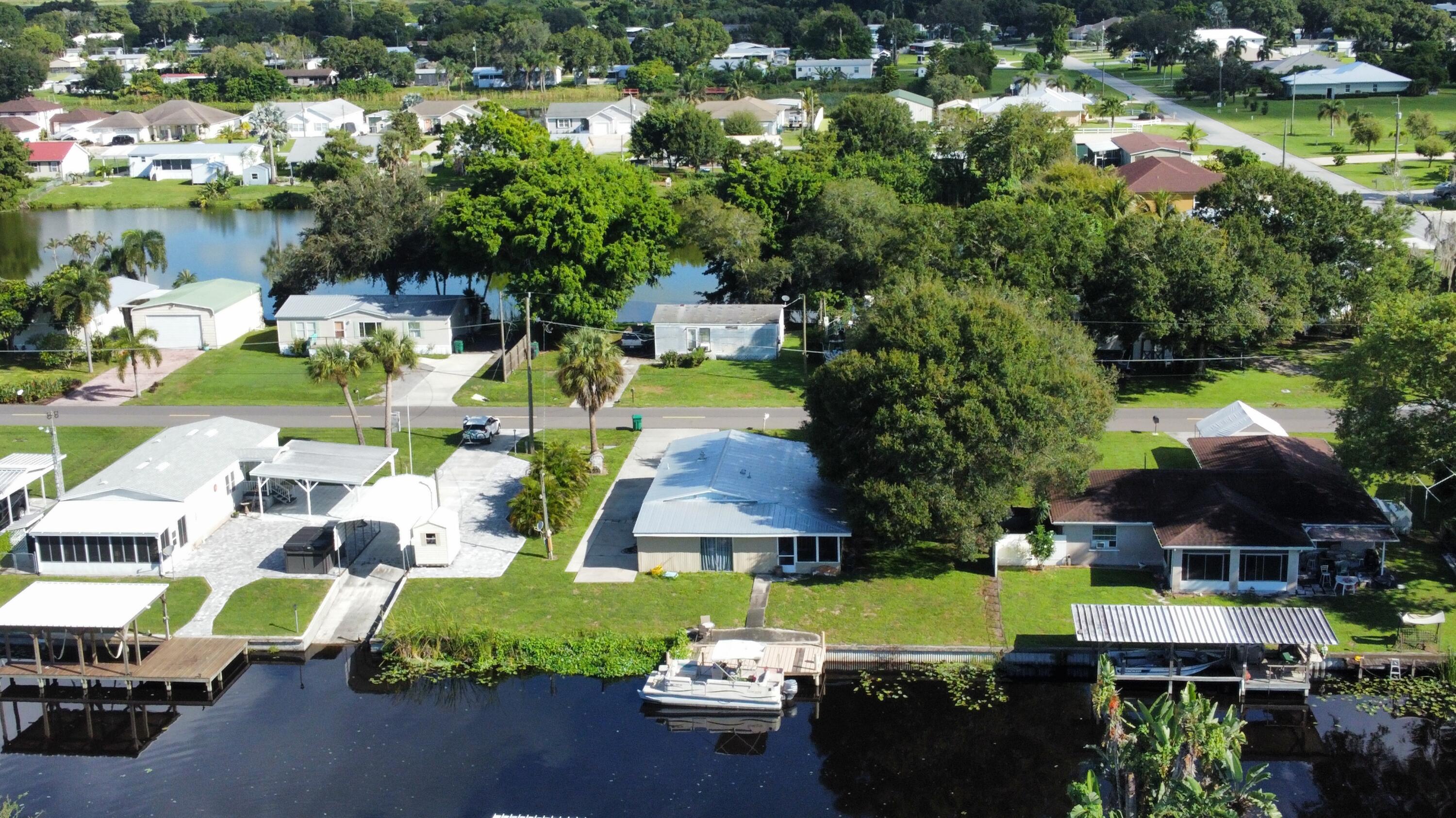 2612 Southeast 29th Street Okeechobee, FL 34974 - Photo 9 of 46 a view of swimming pool with outdoor seating and plants