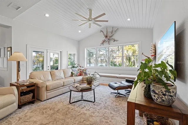 a kitchen with white cabinets and counter space