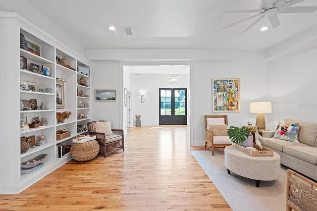 a living room with furniture or couch and a dresser