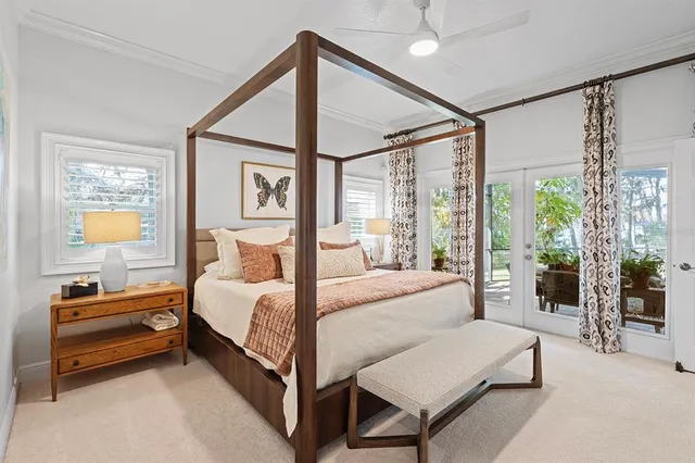 a very nice looking bedroom with a large window