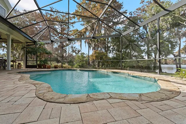 a view of a swimming pool with a patio