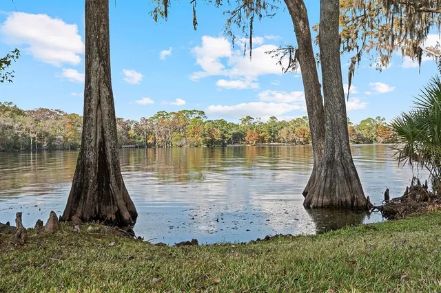a view of a garage with wooden table and chairs