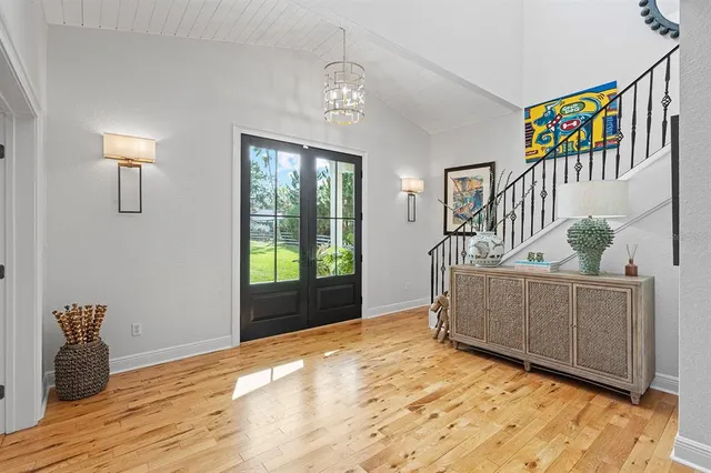 a view of an entryway with wooden floor