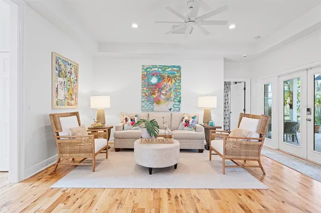 a living room with furniture and wooden floor