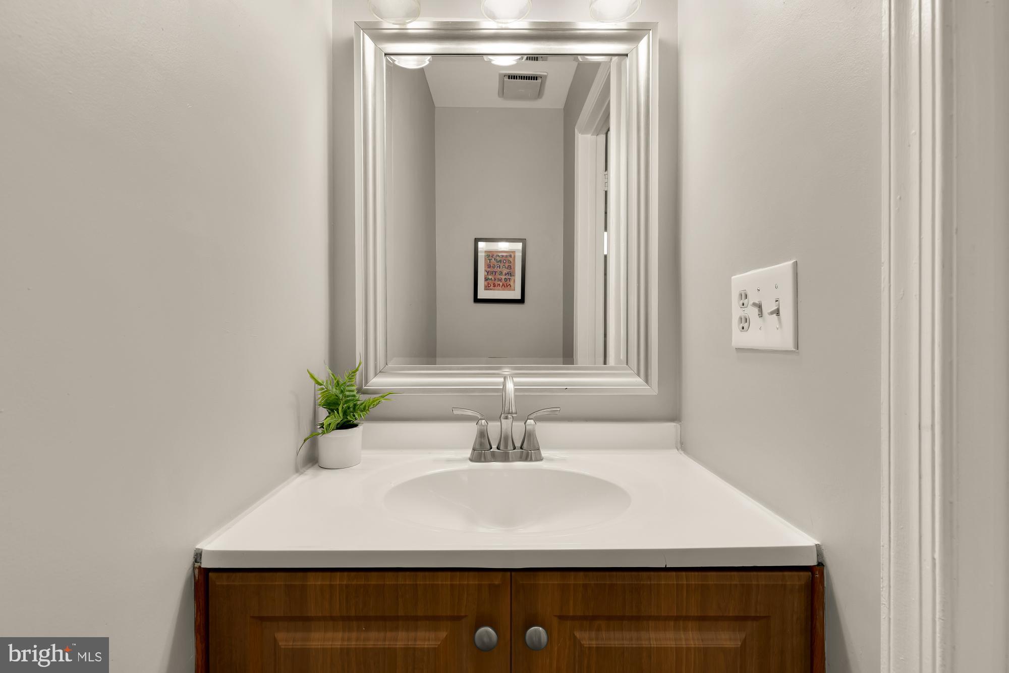 2446 South Walter Reed Drive, Unit B Arlington, VA 22206 - Photo 11 of 26 Sleek main level half bath