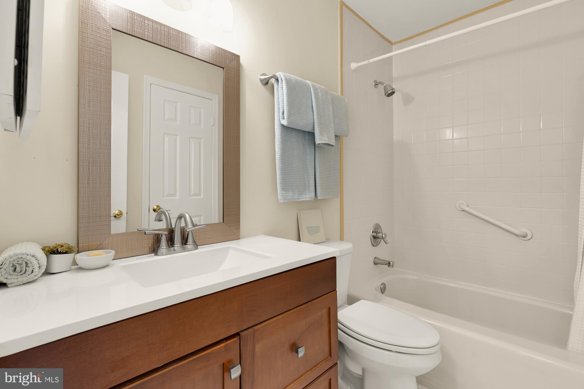 2446 South Walter Reed Drive, Unit B Arlington, VA 22206 - Photo 16 of 26 Modern bathroom with sleek finishes.