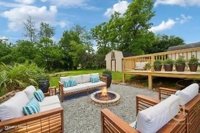 a view of balcony with furniture and garden