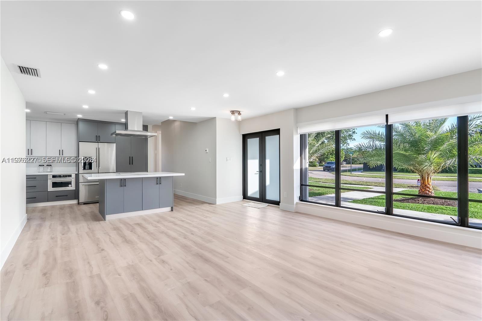 8421 Southwest 27th Terrace Miami, FL 33155 - Photo 2 of 22 a view of kitchen with stainless steel appliances refrigerator oven and cabinets