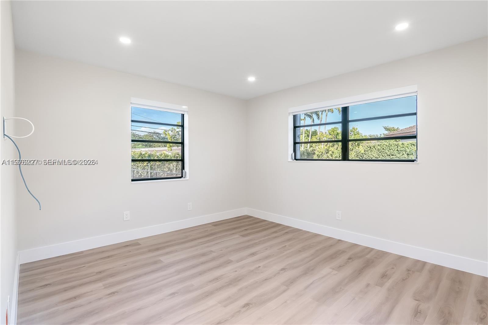 8421 Southwest 27th Terrace Miami, FL 33155 - Photo 22 of 22 an empty room with wooden floor and window