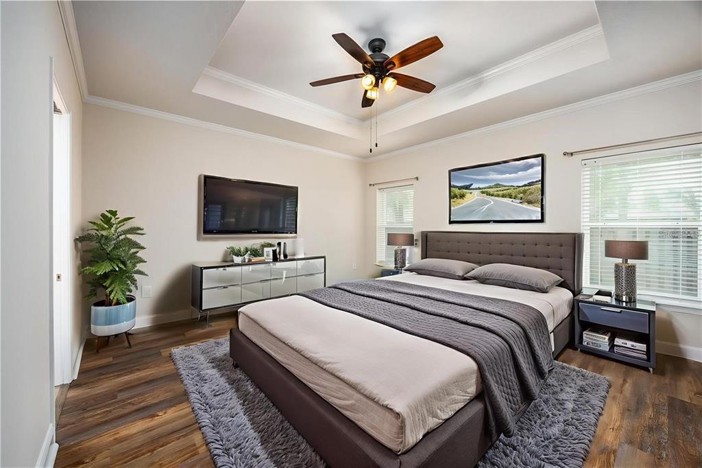 8216 Northwest 54th Street Gainesville, FL 32653 - Photo 35 of 58 a bedroom with a bed a flat screen tv and a couch