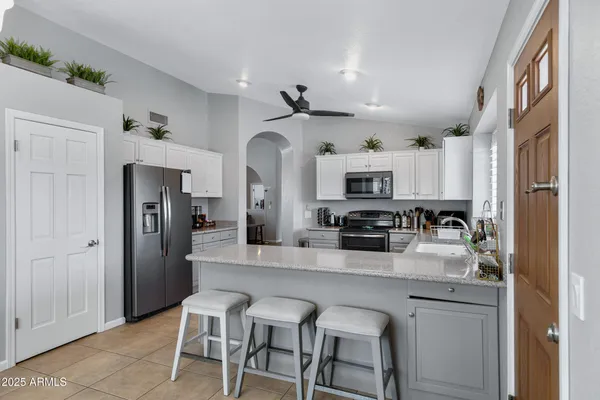 a work room with furniture and a window