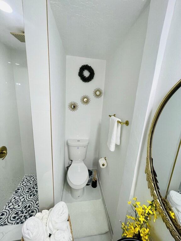 5537 Southwest 6th Street Margate, FL 33068 - Photo 22 of 40 a bathroom with a toilet and a shower