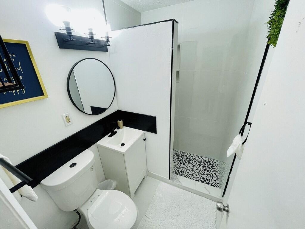 5537 Southwest 6th Street Margate, FL 33068 - Photo 28 of 40 a bathroom with a toilet and a sink