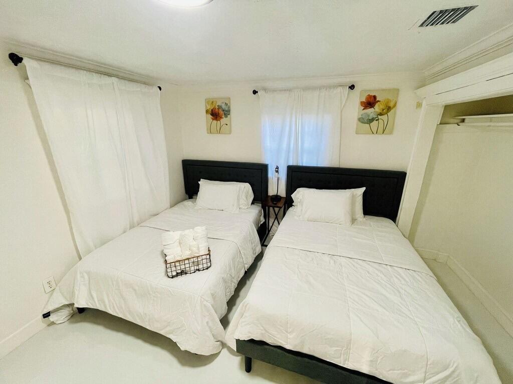 5537 Southwest 6th Street Margate, FL 33068 - Photo 31 of 40 a bedroom with bed and a window