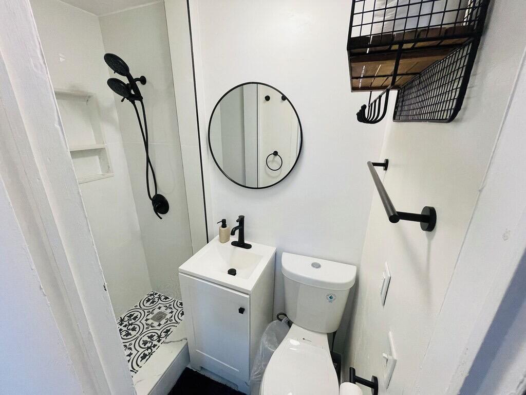 5537 Southwest 6th Street Margate, FL 33068 - Photo 33 of 40 a bathroom with a toilet and a sink