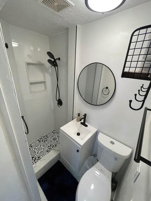 5537 Southwest 6th Street Margate, FL 33068 - Photo 35 of 40 a bathroom with a toilet sink and mirror