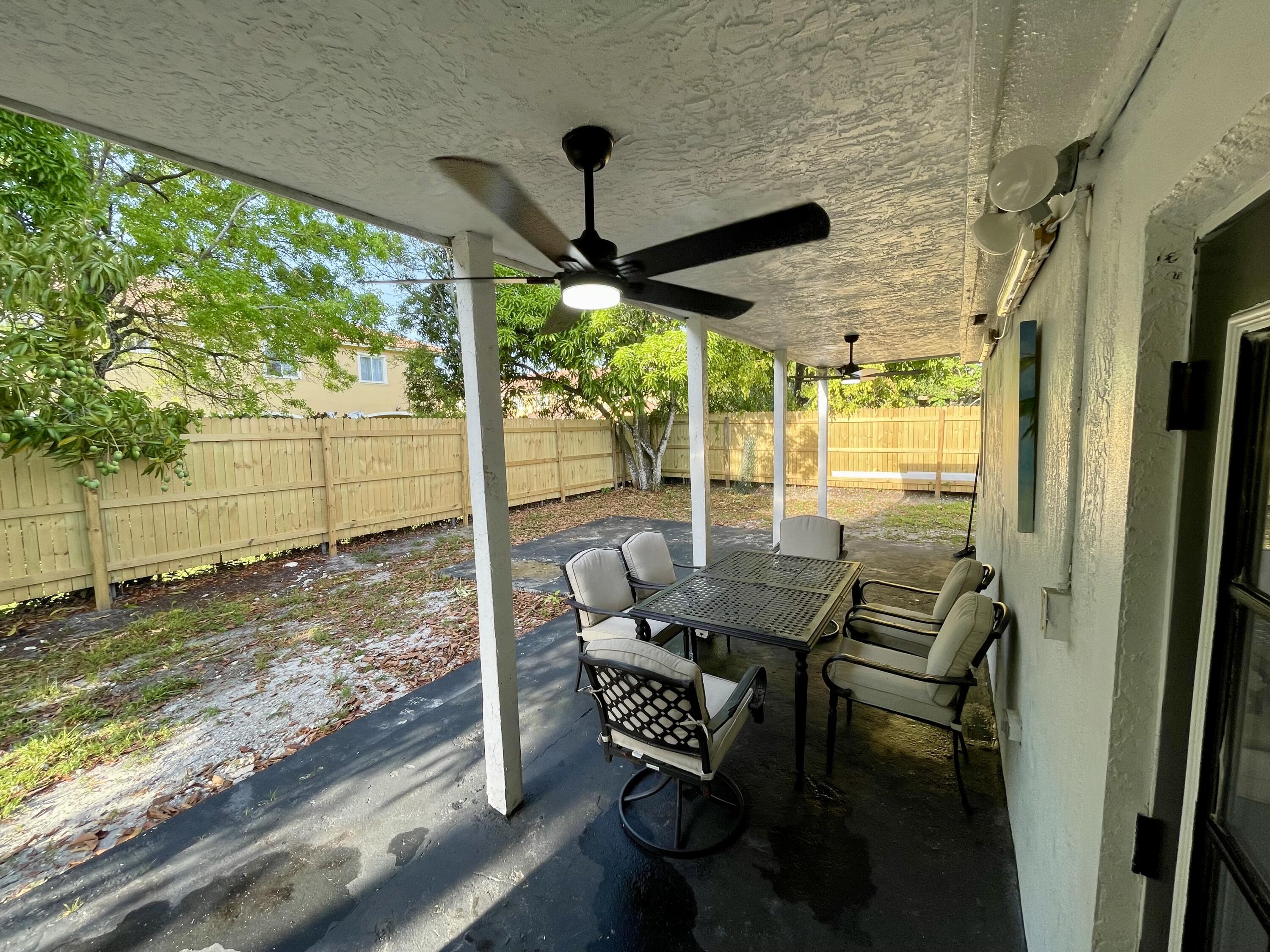 5537 Southwest 6th Street Margate, FL 33068 - Photo 36 of 40 a view of a porch with furniture and a yard