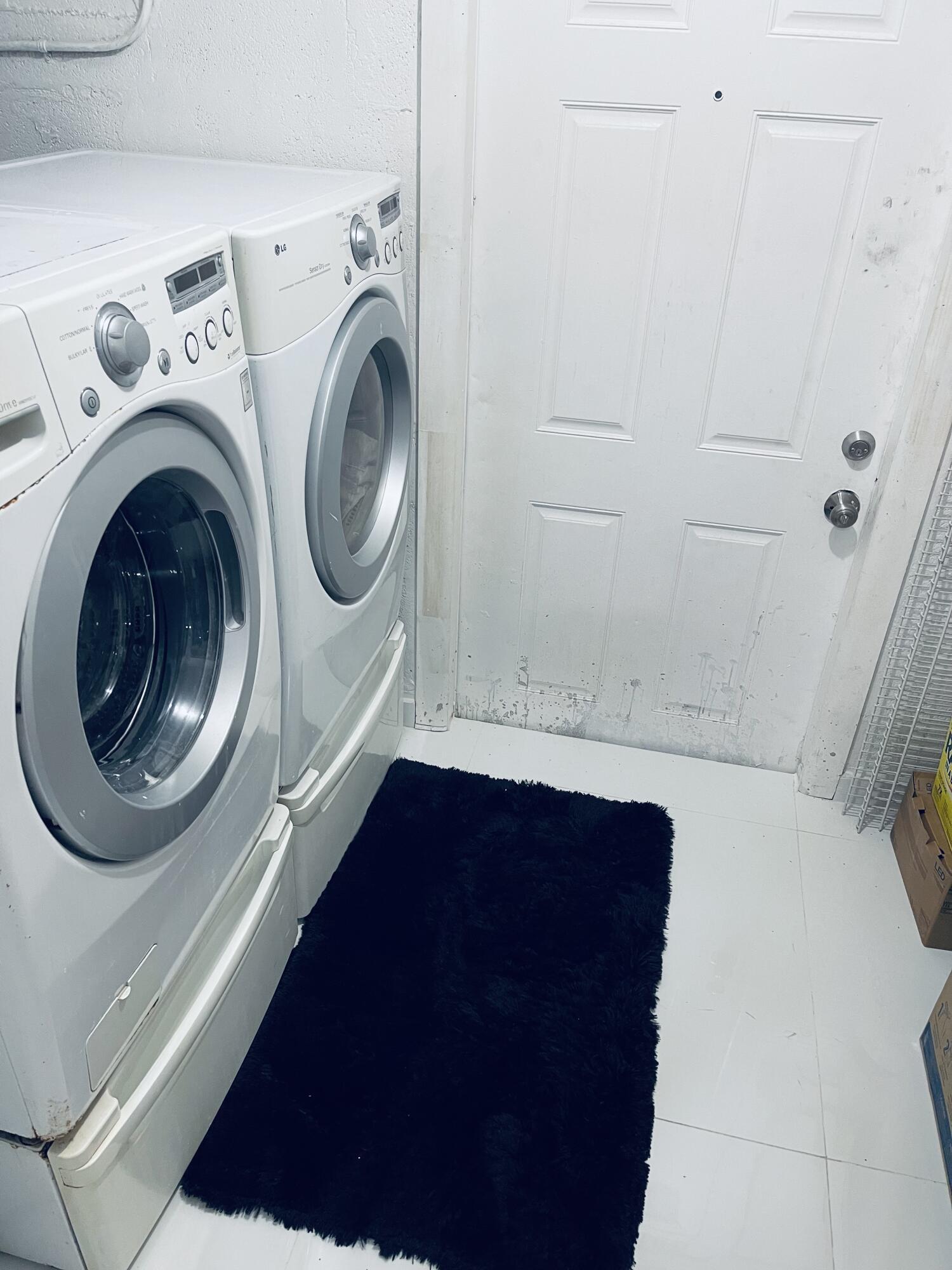 5537 Southwest 6th Street Margate, FL 33068 - Photo 39 of 40 a utility room with dryer and washer