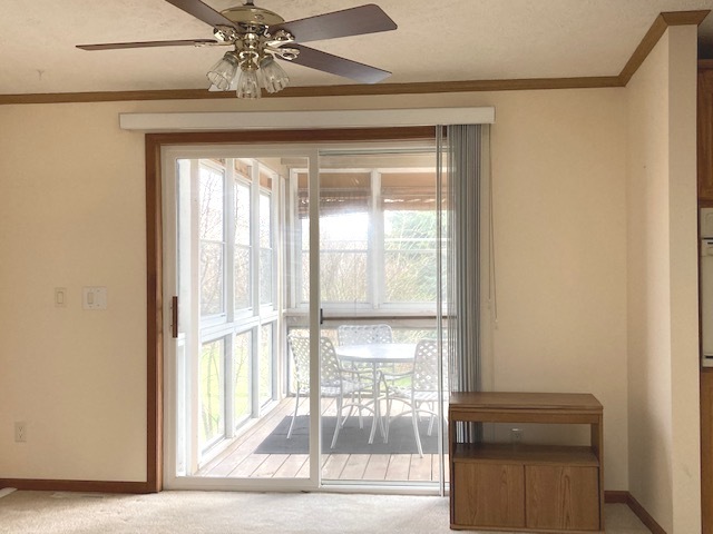 895 Cayuga Trail Marengo, IL 60152 - Photo 11 of 39 a view of a livingroom with a ceiling fan and window