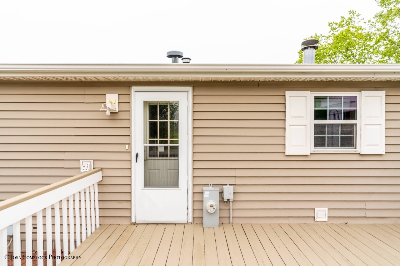 895 Cayuga Trail Marengo, IL 60152 - Photo 25 of 39 a view of a balcony with a window and wooden floor