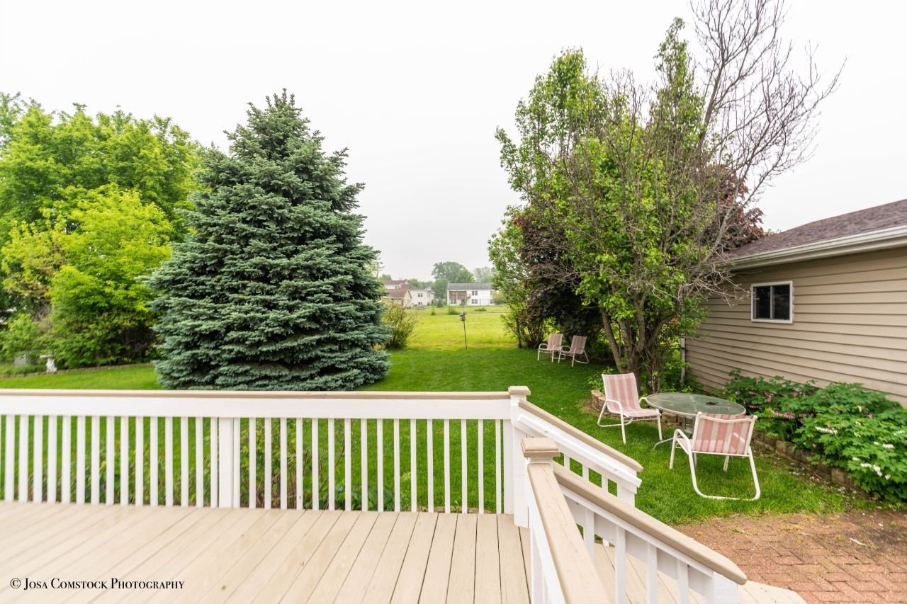 895 Cayuga Trail Marengo, IL 60152 - Photo 30 of 39 a balcony with wooden floor and outdoor space
