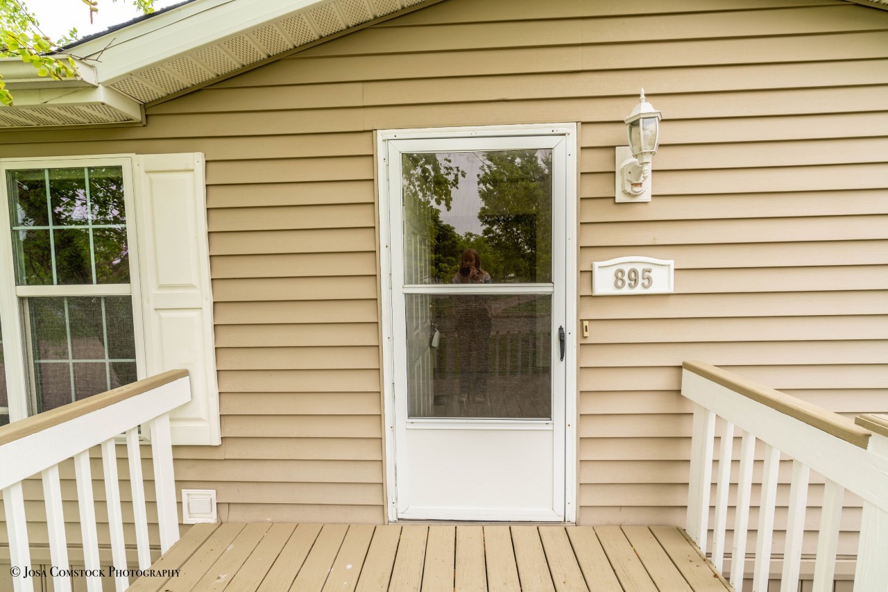 895 Cayuga Trail Marengo, IL 60152 - Photo 4 of 39 a view of a balcony with a couple of potted plants
