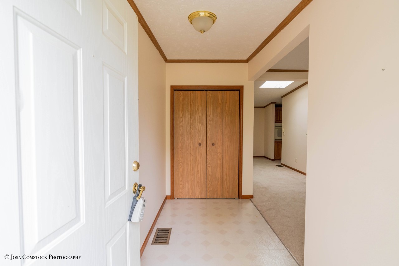 895 Cayuga Trail Marengo, IL 60152 - Photo 5 of 39 a view of a livingroom with wooden floor and cabinet
