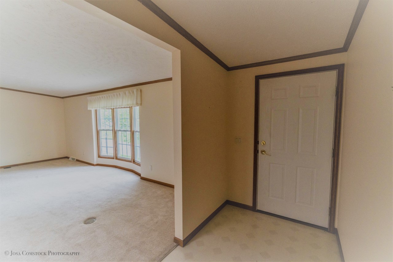 895 Cayuga Trail Marengo, IL 60152 - Photo 6 of 39 a view of an empty room with a window