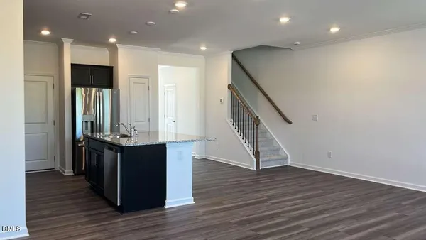 a view of kitchen with cabinets and wooden floor