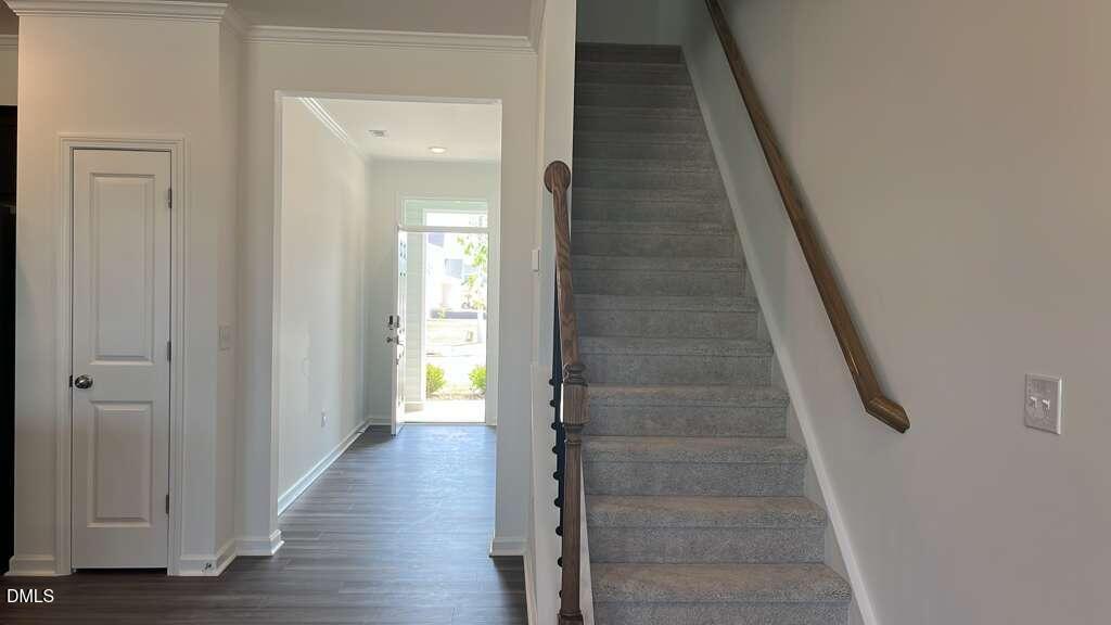 142 Blossom Fld Way Angier, NC 27501 - Photo 13 of 33 a view of a hallway with wooden floor and entryway