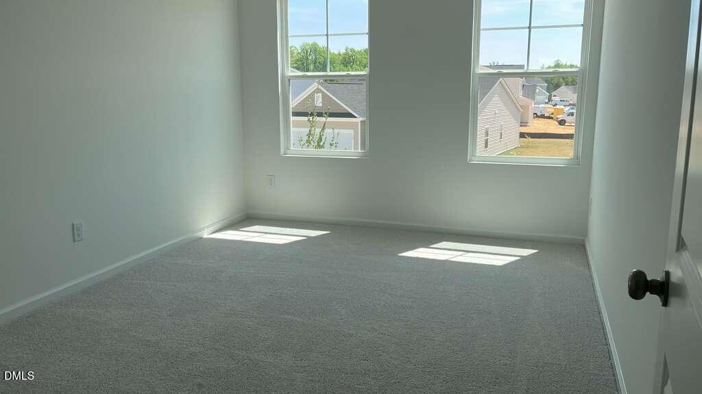 142 Blossom Fld Way Angier, NC 27501 - Photo 21 of 33 a view of empty room with windows