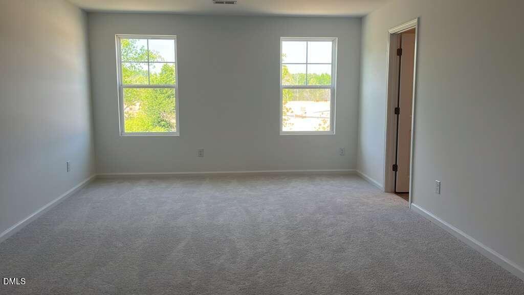 142 Blossom Fld Way Angier, NC 27501 - Photo 25 of 33 an empty room with windows