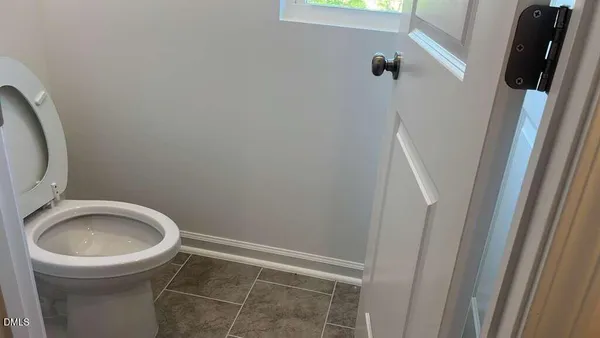 a bathroom with a double vanity sink a mirror and a shower