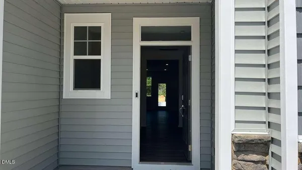 a view of front door of house and windows