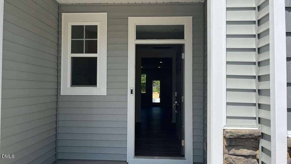 142 Blossom Fld Way Angier, NC 27501 - Photo 3 of 33 a view of front door of house and windows