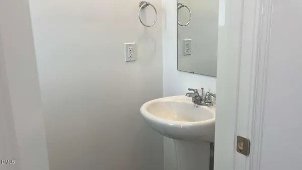 a bathroom with a sink and mirror