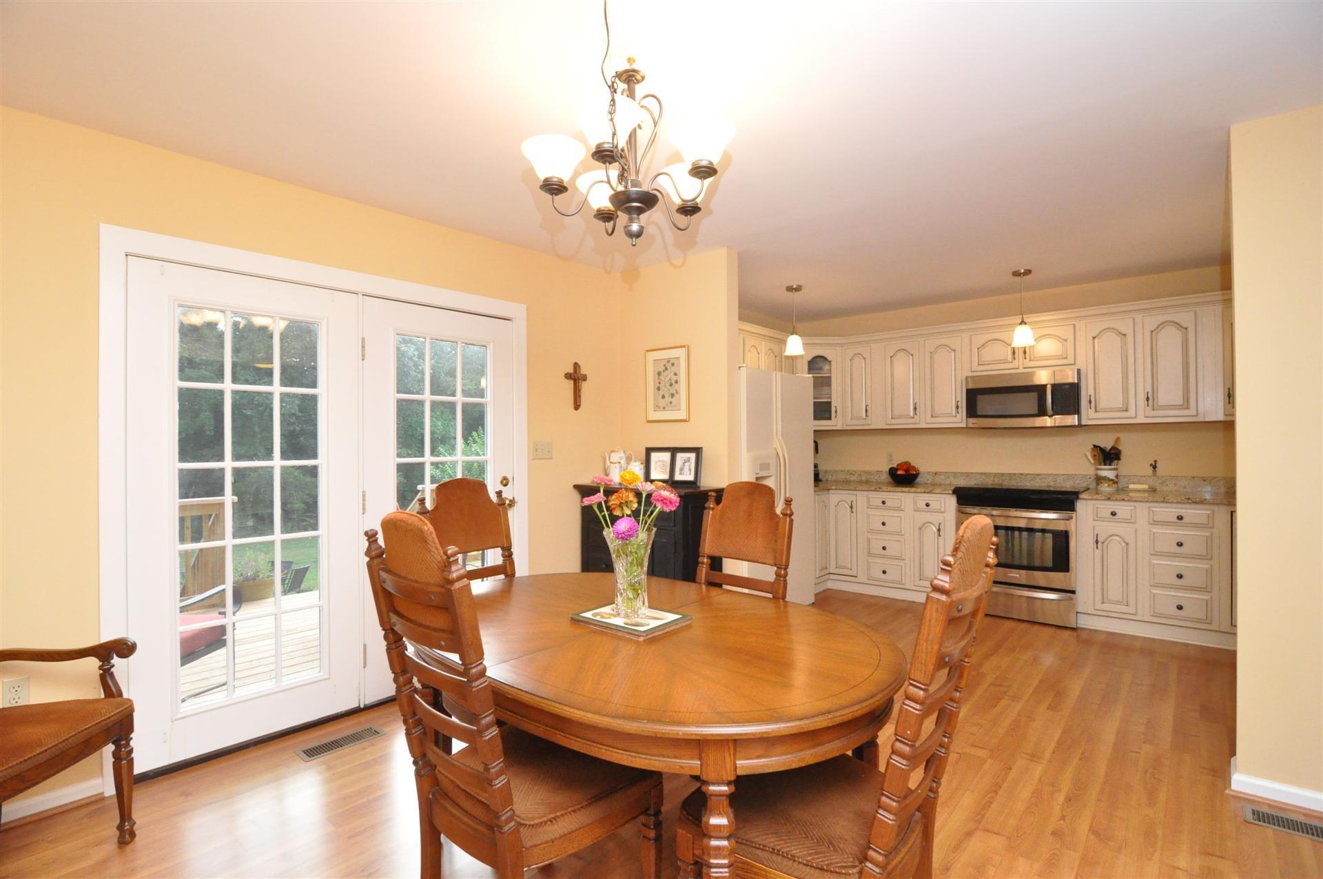 505 White Oak Lane Tryon, NC 28782 - Photo 23 of 43 a view of a dining room with furniture and wooden floor