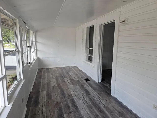 a view of wooden floor in an empty room