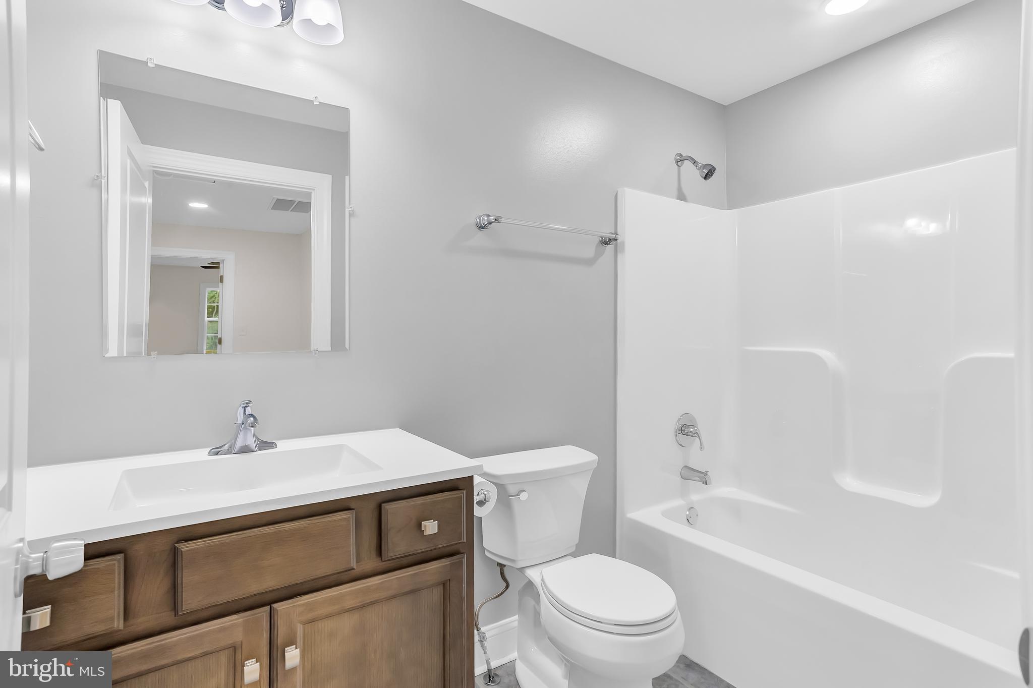 26519 Siloam Road Salisbury, MD 21801 - Photo 45 of 69 a bathroom with a sink toilet and shower