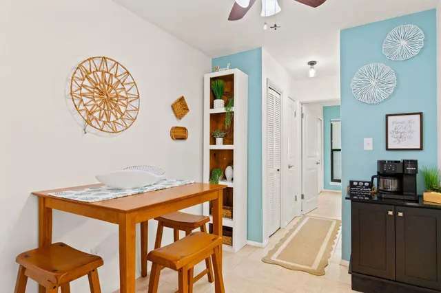 a view of a dining room with furniture and a table