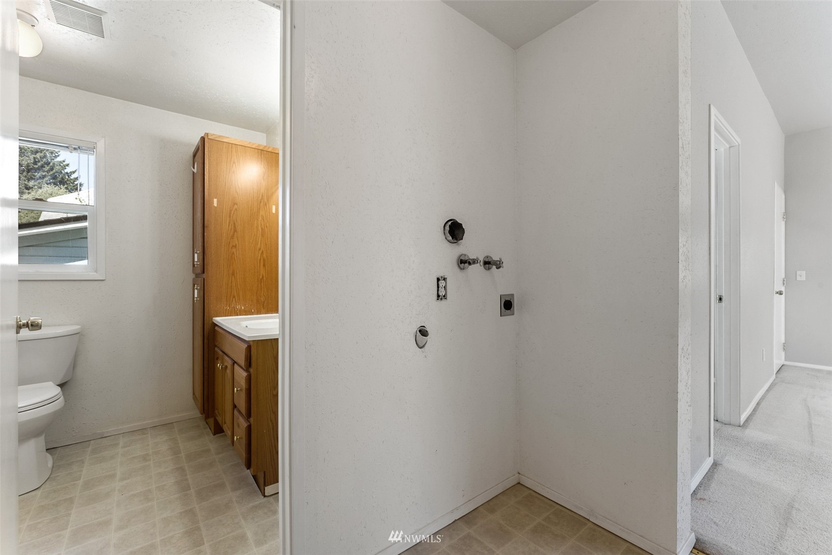 1234 South State Street Tacoma, WA 98405 - Photo 14 of 26 a bathroom with a toilet and a sink