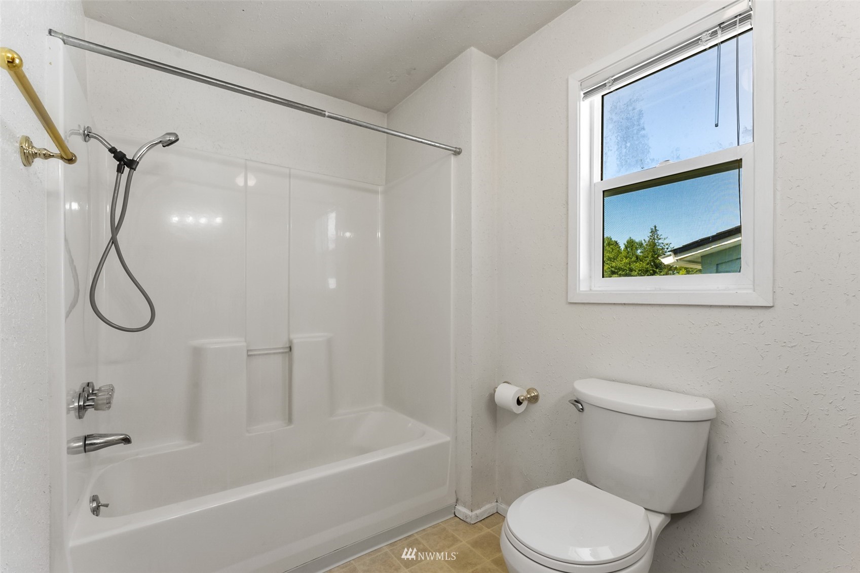 1234 South State Street Tacoma, WA 98405 - Photo 15 of 26 a white toilet sitting next to a bath tub shower