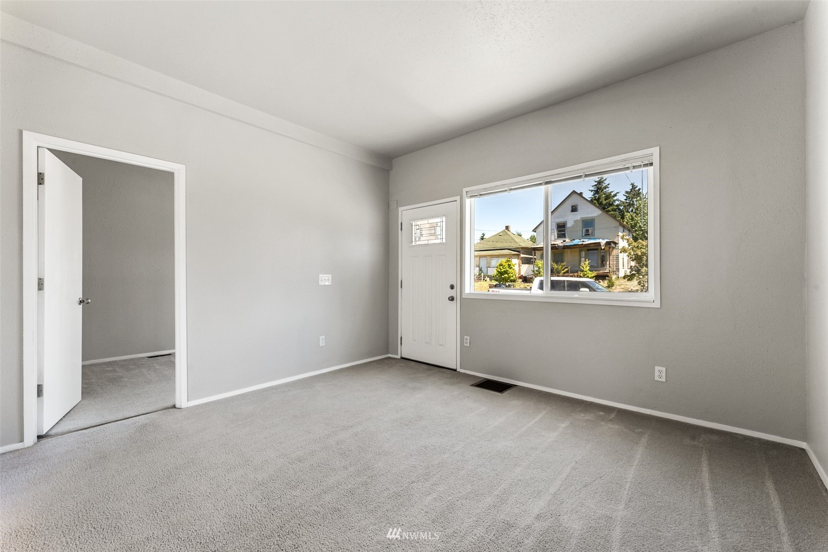 1234 South State Street Tacoma, WA 98405 - Photo 5 of 26 an empty room with windows and cabinet