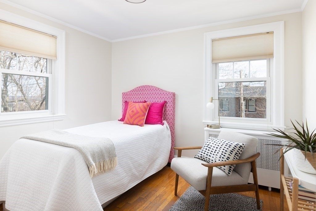 24 Jordan Road Brookline, MA 02446 - Photo 14 of 27 a bedroom with a bed and windows