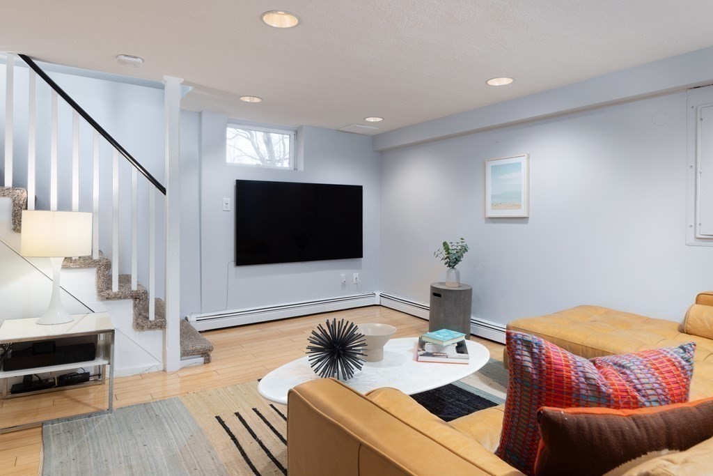 24 Jordan Road Brookline, MA 02446 - Photo 15 of 27 a living room with furniture and a flat screen tv
