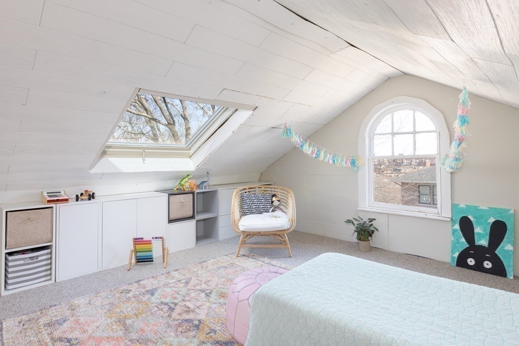 24 Jordan Road Brookline, MA 02446 - Photo 18 of 27 a bedroom with furniture and a large window