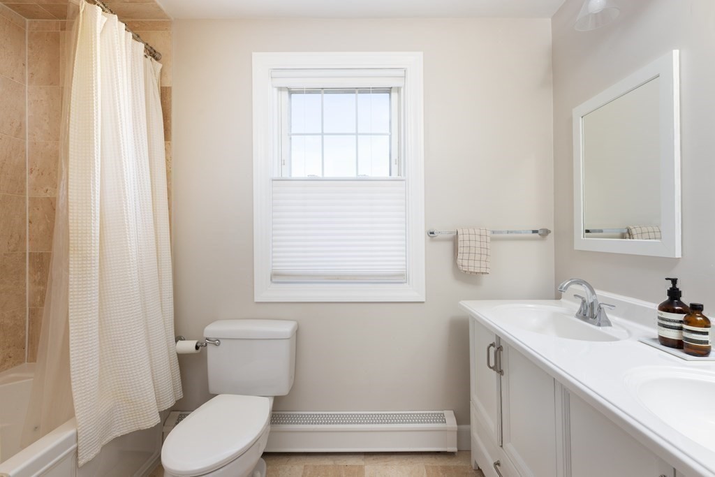 24 Jordan Road Brookline, MA 02446 - Photo 20 of 27 a bathroom with a sink toilet and vanity